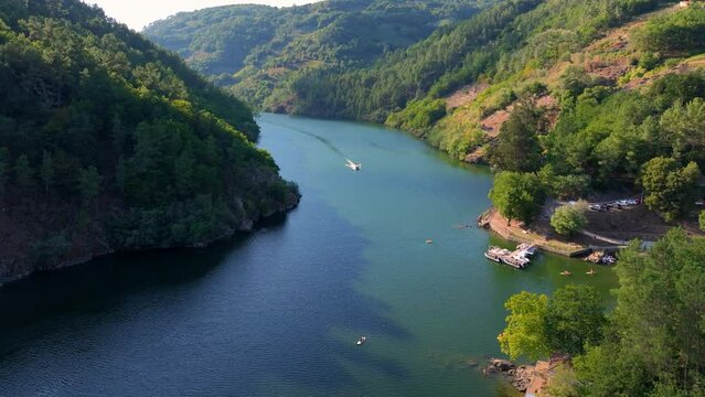 Boat Cruising In The Minho River With Praia da Coba In Summer In Lugo, Spain. - aerial
