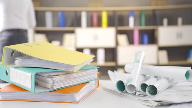 Workload. Businessman examines documents.