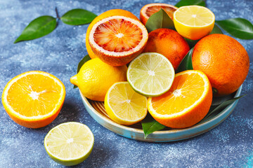 front view fresh sliced orange on dark background ripe mellow fruit juice color citrus tree citrus, Whole and sliced ripe oranges placed on marble background, half orange fruit.