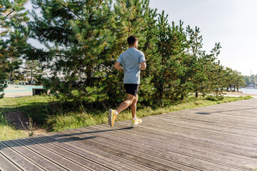 A strong hardy athlete training outdoors. An active and healthy lifestyle of a person. Runner...