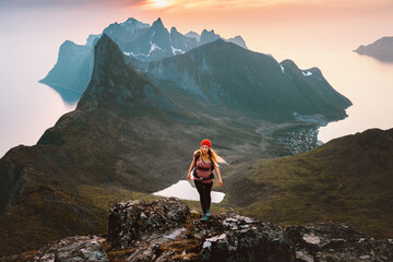 Woman hiking solo in Norway travel outdoor healthy lifestyle active girl with backpack exploring...