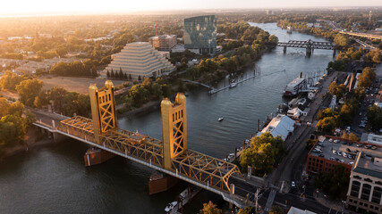 Sunset view of the historic 1935 Tower Bridge and the downtown skyline of Old Sacramento,...