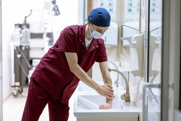 male surgeon washes his hands before surgery, doctor's sterile hands