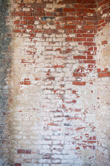 Brick shabby wall made of old burnt brick. Background for designers. Space for text.