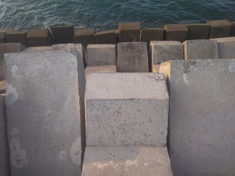Construction of a cement wall to prevent waves on the beach
