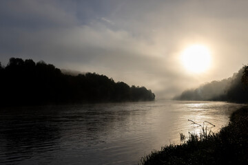 Small fog on the river in autumn