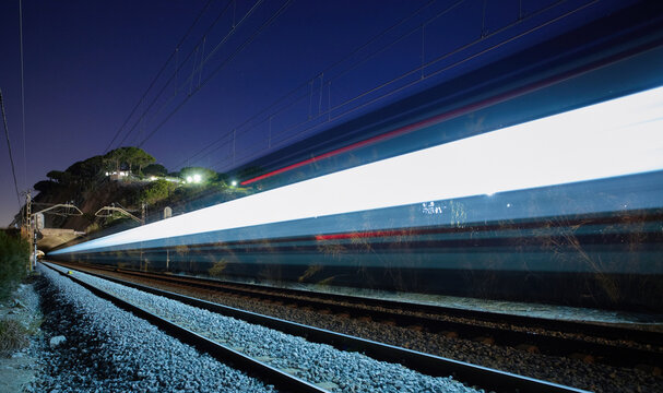 Magnificent view of fast train against starry sky