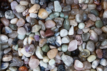 Closeup of various colorful stones quartz, marbles, ore minerals, gems use as ornament and decoration jewelry that contain spiritual force human believes 