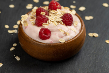 fresh yogurt with raspberry flavor and oat flakes