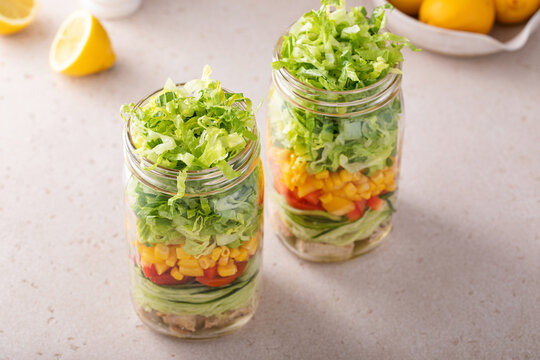 Chicken and vegetable salad in a jar, meal prep for healthy lunch on the go