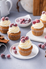 Spiced Christmas cupcakes with cream cheese frosting with sugared cranberries