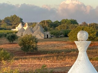 ancient trulli in Apulian countryside (Italy)