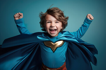 Child superhero on a blue background. Masquerade costume of a superhero