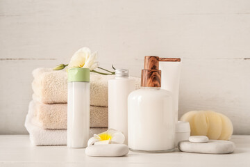 Fototapeta na wymiar Set of spa supplies on white wooden background