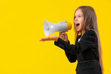 Cute little producer shouting into megaphone on yellow background