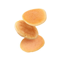 Tasty fresh pancakes falling on white background