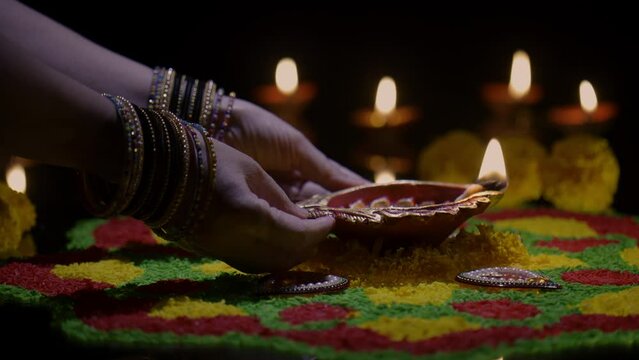 Clay diya lamps lit during diwali celebration, Diwali, or Deepavali, is India's biggest and most important holiday.