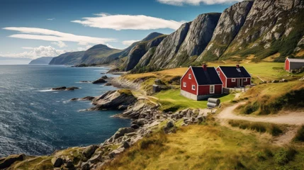 Poster Norwegian landscape with old redwood barns at the sea coast © sirisakboakaew