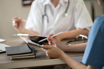 Doctor and the patient sit and talk about the patient's disease.