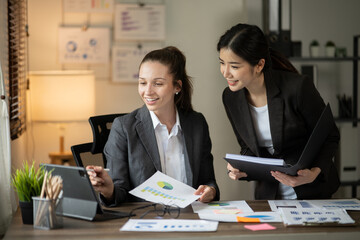 Asian businessmen, women and men Talk about new projects, presents at home office.
