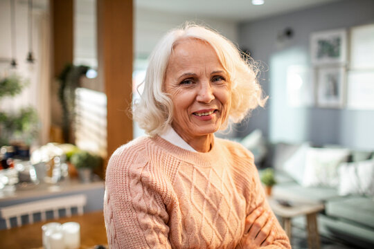 Portrait of senior woman posing at her home