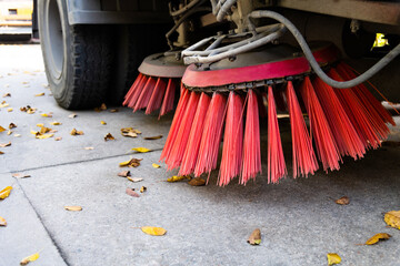 Close up of street sweeper cleaning city street