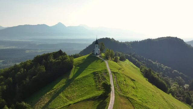 Aerial view of St. Primoz Church, Jamnik, Slovenia, summer morning light