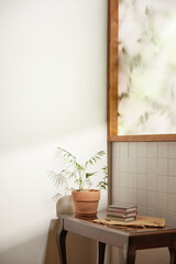 A comfortable room where warm afternoon sunlight
comes in through a window with a view of tree leaves