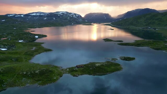 Sunset Nature Landscape in Norway - Stavatn Lake and Snow Covered Mountains Peaks - Vestland, Vestfold og Telemark - Aerial Circling