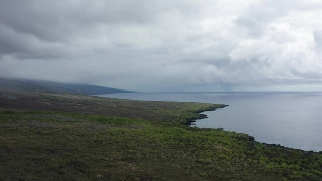 Low aerial shot flying over the coastline near Honaunau Bay on the Big Island of Hawai'i. 4K