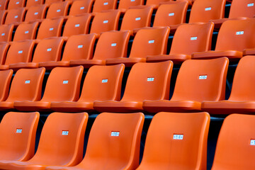 Empty orange seat in stadium