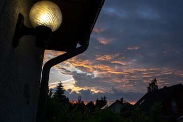 sunset clouds in the city, street lights, architecture