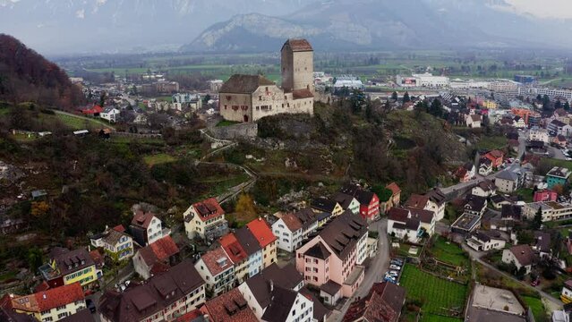 Aerial View of Sargans Castle and Municipality, St. Gallen, Switzerland. Town Buildings and Landscape in Autumn, Revealing Drone Shot