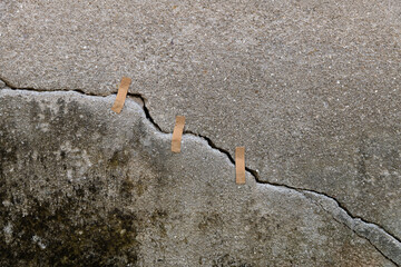 Cracked concrete wall with adhesives