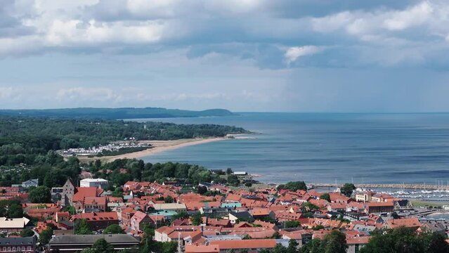 Long coastline along swedish port city Simrishamn, rain clouds approaching