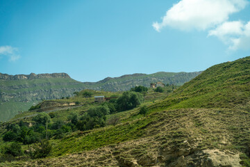 Fototapeta na wymiar Village of Chokh in Dagestan. Facades of houses located in tiers on a steep slope, summer landscape.