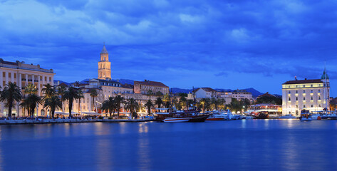 Split skyline illuminated at dusk with the Adriatic Sea on the foreground, Croatia