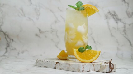 Selective focus Fresh orange juice mix coconut with fruits, copy space.  Ramadhan drink