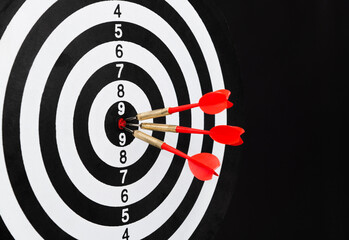 Three darts hitting on center target