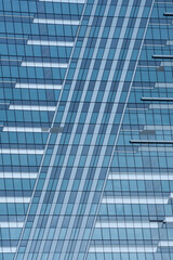 Fototapeta premium Dive into the captivating world of skyscraper facades, where architectural patterns and designs create a striking urban tapestry, perfect for capturing the essence of modern cityscapes.