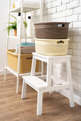 Plastic storage baskets in a bathroom interior