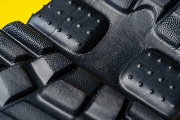 Rubber sole of a sports sneaker close up