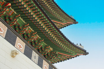 Fototapeta na wymiar Ant's-Eye View of part of the Korean style arch roof at Gyeongbokgung Palac in Seoul, Korea. Picture For use in illustrations Background image or copy space.