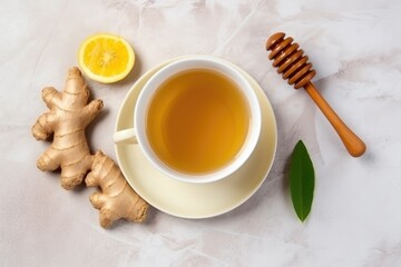 top view of hot ginger tea in a ceramic mug on marble countertop