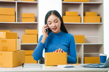 Asian woman people tackling warehouse tasks with dedication, realities of small web business management, e-commerce , dynamic world of small online business operations, efficient inventory management
