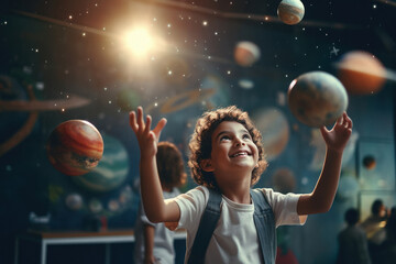 Little boy playing with planet in galaxy. dream of astronaut. - obrazy, fototapety, plakaty