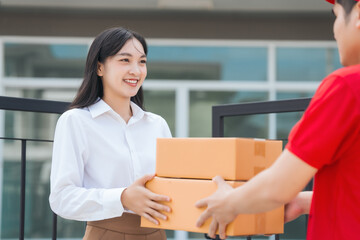 Asian people received product box from male delivery service person, modern e-commerce, home...