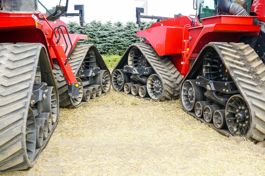 Two off road agricultural machines with triangle rubber crawler suspension, crawler transmission