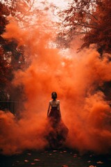 Woman in red and orange smoke. Autumn