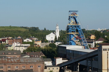 Laziska Srednie district (former name Mittel Lazisk). Mine shaft hoisting tower, parish church in...
